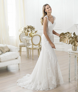 Lace fit-and flare gown with dimensional floral applique